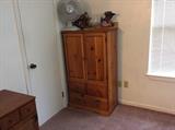 small oak cabinet - opens at top, drawers at bottom