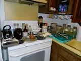 Kitchen - jars, tea kettle, silverware, pie plates, coffee cups, crock canister set with wooden lids
