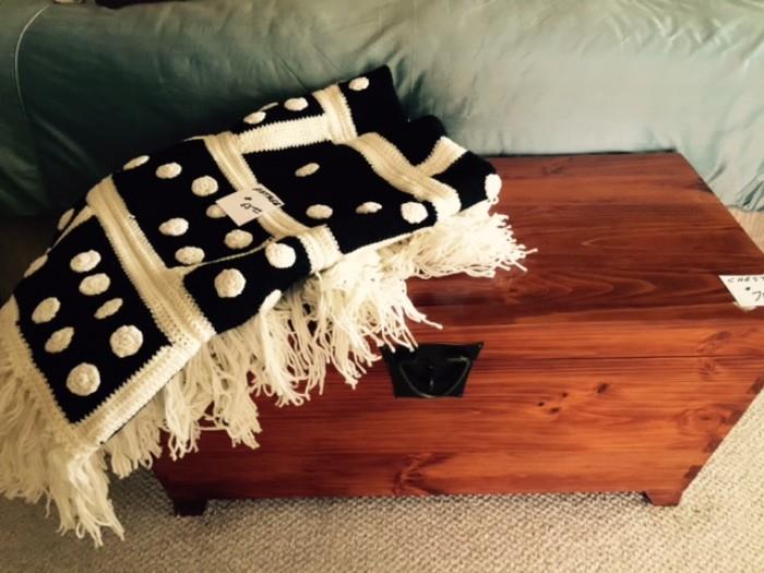 Gorgeous wooden chest and vintage blanket.