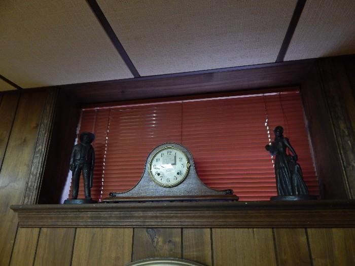 Another mantle clock with two bronze statues/ figurines.