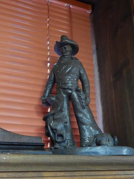 Another bronze statue of cowboy.