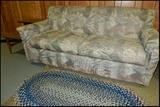 Hide-a-bed sofa, braided rug