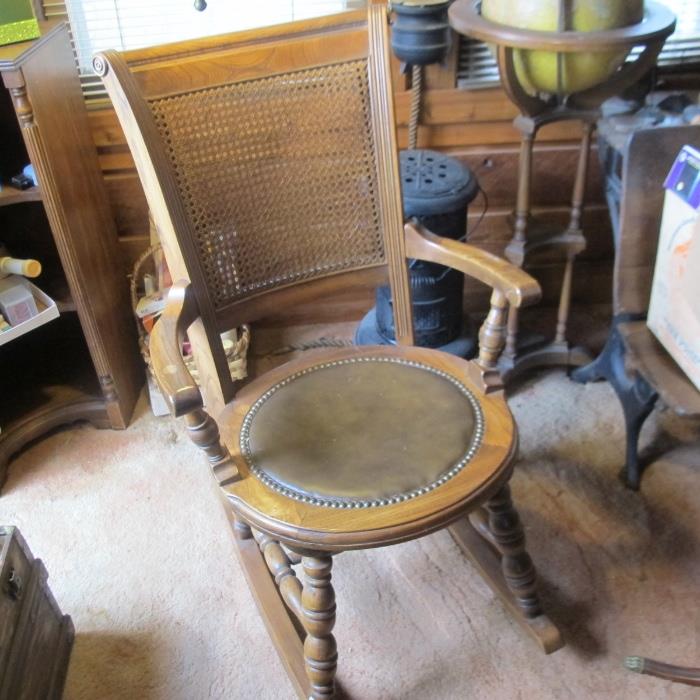ANTIQUE WICKER ROCKER WITH LEATHER SEAT