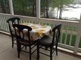Black table with 4 black rush seat chairs 