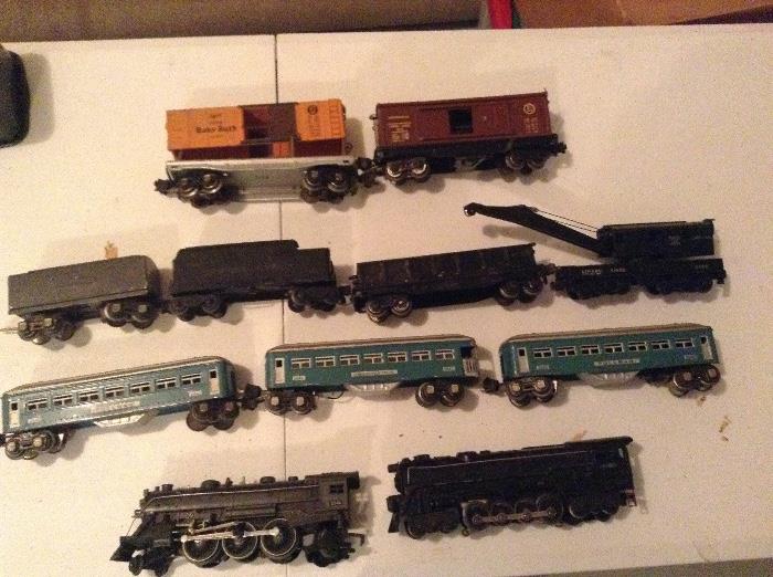 Antique American Flyer trains and a box of track