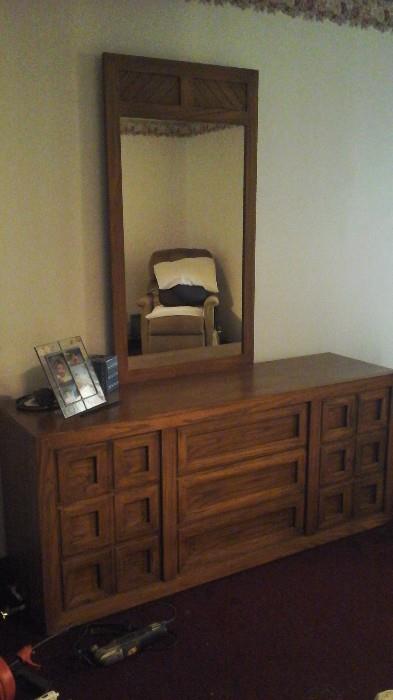 Dresser and mirror has a matching Queen headboard and 2 nightstands