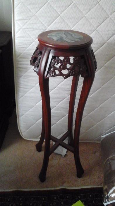 One of two wood pant stands