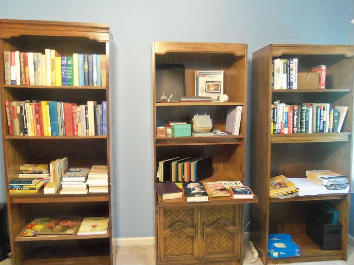 Set of 3 matching bookcases and books.