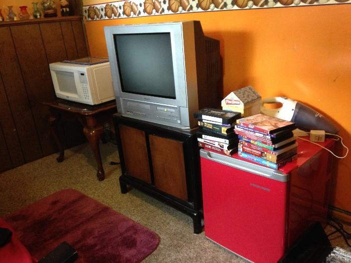 TV with DVD and VHS, microwave, end tables, mini fridge DVDs, VHS, 