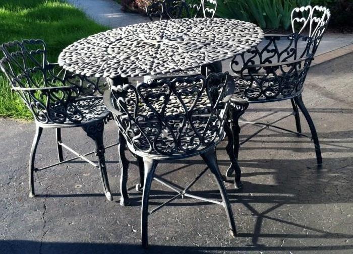 5 piece wrought iron table and 4 chairs