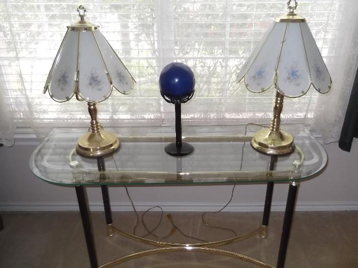 glass table and lamps
