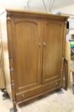 Antique clothing wardrobe, matches vanity inside bedroom