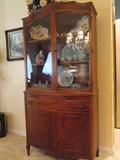 This beautiful china cabinet is part of the 1920s three piece  dining room suite.