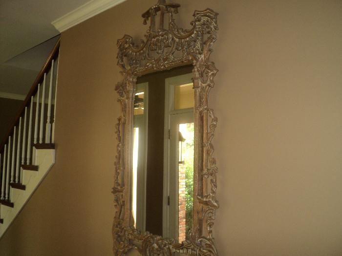 Stunning mirror!  This mirror has incredible carving and would make a statement no matter where you put it in your home!