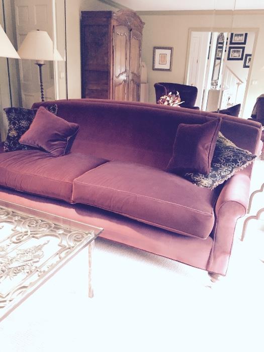 Custom upholstered sofa in burgundy velvet.