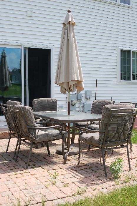Patio set with 6 chairs and umbrella