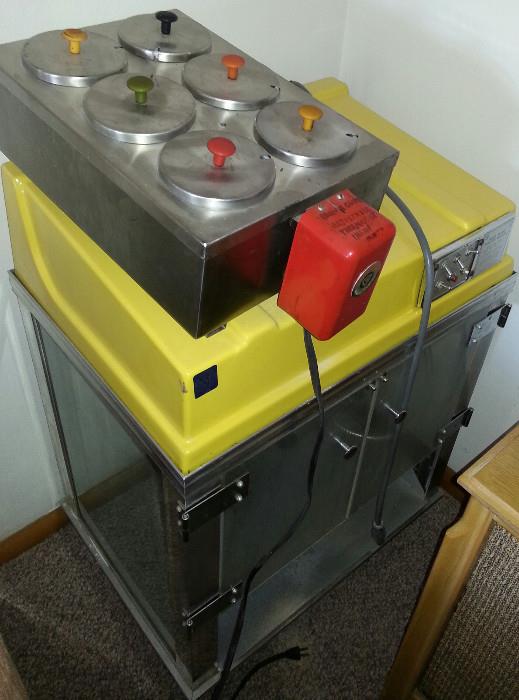 Whiz Bang popcorn machine and ice cream sauce (Strawberry? Chocolate? Pineapple? Hot fudge?) canisters.