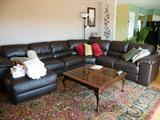 Coffee table is not for sale, but beautiful Einstein Moomjy rug IS for sale! Measures 8x11' Also Chocolate Leather sectional sofa is for sale.