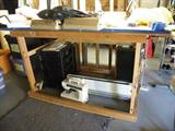 Table will stay with the house, but sewing machine and other items are for sale.