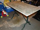 Nice marble-top table with cast-iron legs, green leaf-back chairs (pictured separately) are a set with this table.