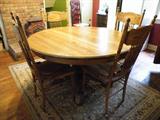 Oak claw foot kitchen table with 2 leaves for all that holiday company!