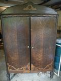 Another antique armoire! Nice wood detail on the front.