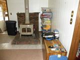 bookcase and items in tubs are for sale in this picture.