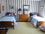 Tiger maple bedroom suite includes twin beds and matching dresser. Pieces can be sold separately.