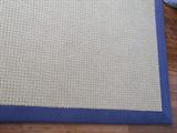 Nice detail of the custom sisal rug. Rug measures 10' x 11.8" with a 3'' blue border.