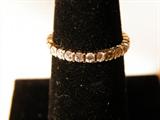 14kt yellow gold eternity band with 26 diamonds surrounding the band. A very beautiful piece of jewelry.