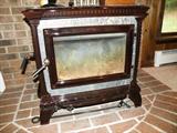 http://www.hearthstonestoves.com/wood-stoves/stove-details?product_id=3
hearthstone heritage soapstone stove, copy and paste link above for specs