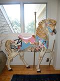 Life size carousel horse. Yes it can support an adult, No, you cannot climb on it. It is not secured to anything.