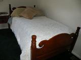 Antique twin size bed with hand crochet coverlet