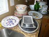 Lots of beautiful kitchen platters and kitchen items.