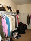 Full walk in closet with name brand clothing. Ladies Sz small.