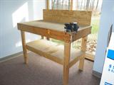 Pine workbench with vise. Sturdy and not too heavy to lift!
