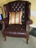 claw-foot leather chairs