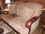 Great upholstered couch trimmed with leather detail.