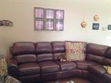 Leather sectional sofa with recliners at each end, delivered only two years ago