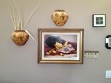 Wall art includes an original oil on board by Gayle Nazon