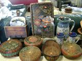 Sally Patchin Baskets and vintqage glassware set on a whitwash sofa table