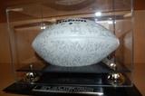 1994 New York Giants white 75th Anniversary football with facsimile signatures in a case.

