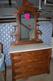 There is a beautiful Victorian marble-top dresser & mirror