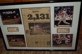 A Cal Ripken Jr. framed collage celebrating his 2131 games with 2 ticket stubs, newspaper article, autographed photo and 3 other photos.