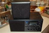 Vintage black KLH 200 stereo radio and separate speaker.