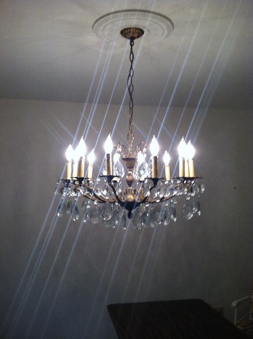 Crystal chandelier -- look how it throws the light! You will need a handyman to take it down.