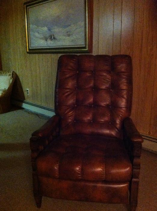 Tufted leather armchair.