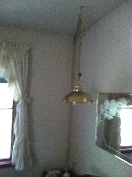 Hanging lamp and mirror.