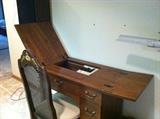 Singer sewing machine table with the sewing machine inside.