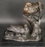 Bronze sculpture of ducks on base
